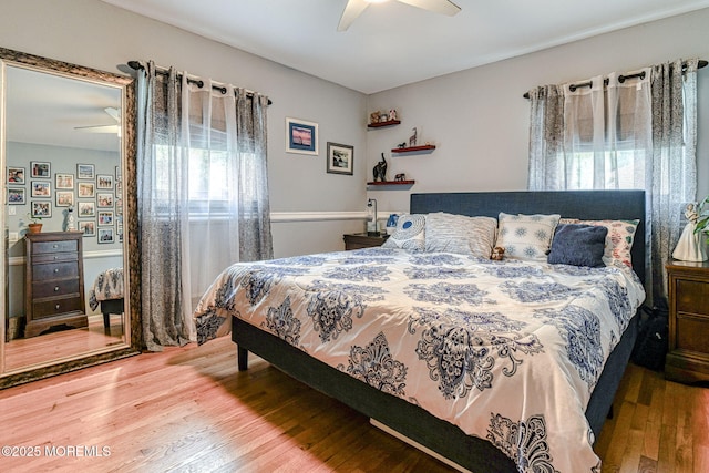 bedroom featuring wood finished floors and ceiling fan