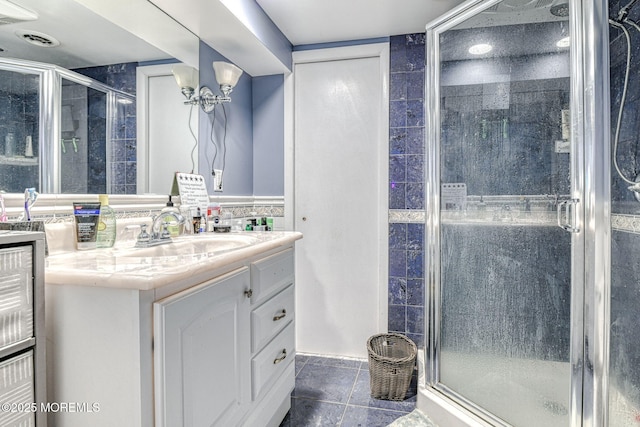 full bathroom with vanity and a shower stall