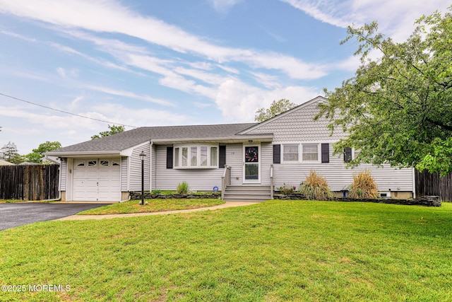 view of front of house with an attached garage and asphalt driveway