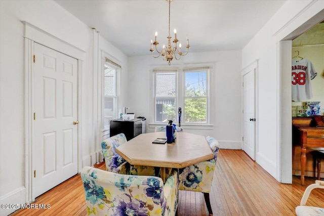 78 Navesink Ave, Highlands, NJ 07732 - dining room with a chandelier, light wood-style floors, and baseboards