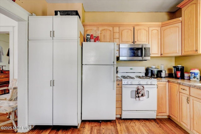 78 Navesink Ave, Highlands, NJ 07732 - kitchen featuring white appliances, light brown cabinetry, and light wood-style flooring