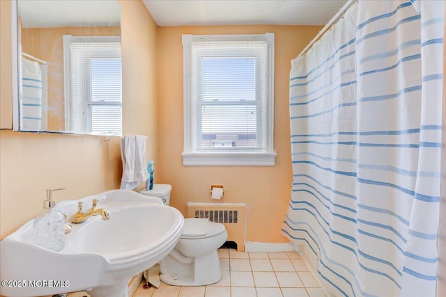 78 Navesink Ave, Highlands, NJ 07732 - bathroom with radiator, healthy amount of natural light, tile patterned floors, and toilet