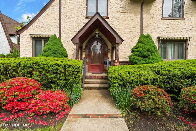 567 Deal Pkwy, Allenhurst, NJ 07711 - view of exterior entry featuring stucco siding