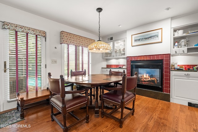 567 Deal Pkwy, Allenhurst, NJ 07711 - dining space featuring a glass covered fireplace, wood finished floors, and recessed lighting
