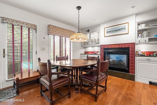 567 Deal Pkwy, Allenhurst, NJ 07711 - dining space with a tiled fireplace, wood finished floors, and recessed lighting