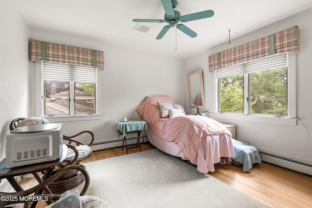 567 Deal Pkwy, Allenhurst, NJ 07711 - bedroom with wood finished floors, a baseboard radiator, and ceiling fan