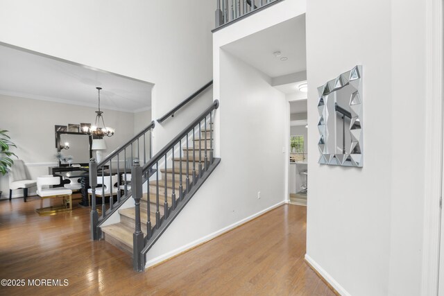 29 Jefferson Ct, Jackson, NJ 08527 - staircase featuring wood finished floors, baseboards, a chandelier, ornamental molding, and a towering ceiling