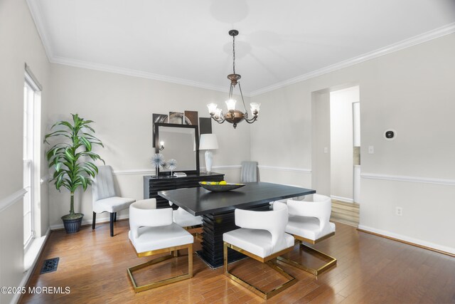 29 Jefferson Ct, Jackson, NJ 08527 - dining area featuring wood finished floors, a chandelier, ornamental molding, and baseboards