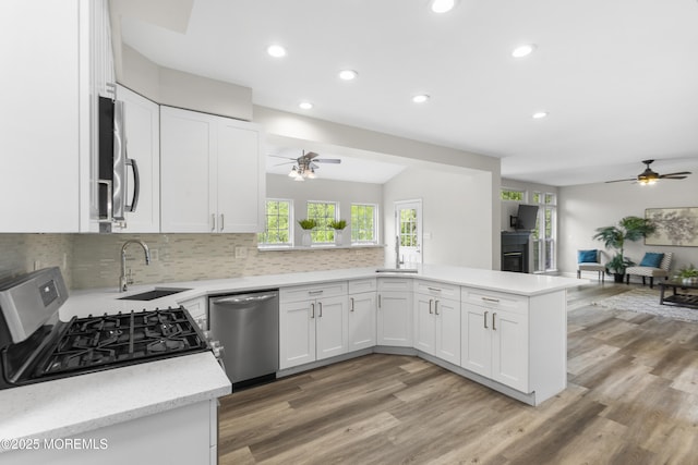 29 Jefferson Ct, Jackson, NJ 08527 - kitchen with stainless steel appliances, ceiling fan, a peninsula, open floor plan, and white cabinets