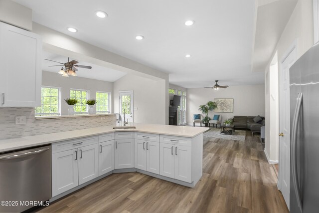 29 Jefferson Ct, Jackson, NJ 08527 - kitchen featuring appliances with stainless steel finishes, a ceiling fan, a peninsula, tasteful backsplash, and light countertops
