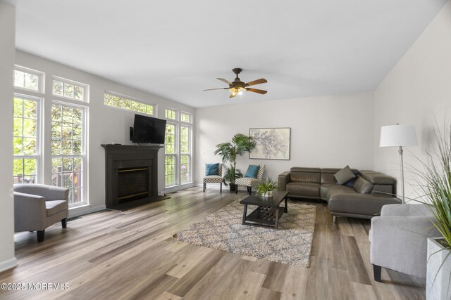 29 Jefferson Ct, Jackson, NJ 08527 - living room with healthy amount of natural light, wood finished floors, and a fireplace