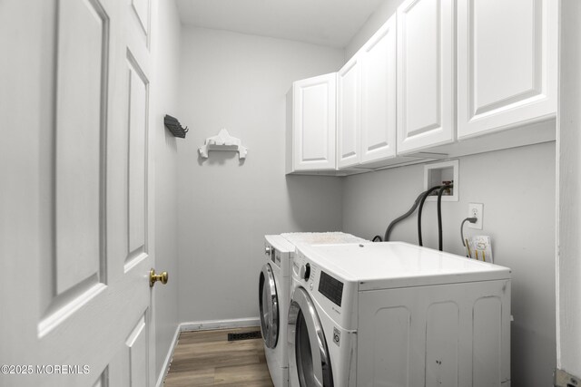 29 Jefferson Ct, Jackson, NJ 08527 - laundry area with cabinet space, washer and clothes dryer, wood finished floors, and baseboards
