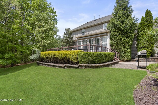 29 Jefferson Ct, Jackson, NJ 08527 - rear view of house featuring a lawn, a patio area, and a deck