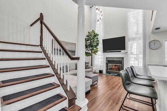11 Charles Ct, Ocean Twp, NJ 07712 - stairs featuring wood finished floors and a fireplace