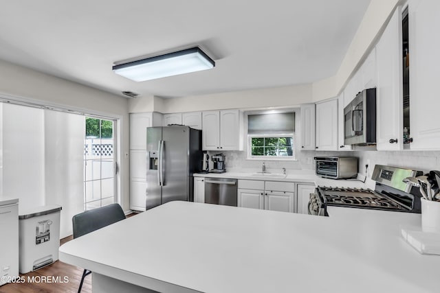 11 Charles Ct, Ocean Twp, NJ 07712 - kitchen featuring stainless steel appliances, backsplash, and healthy amount of natural light