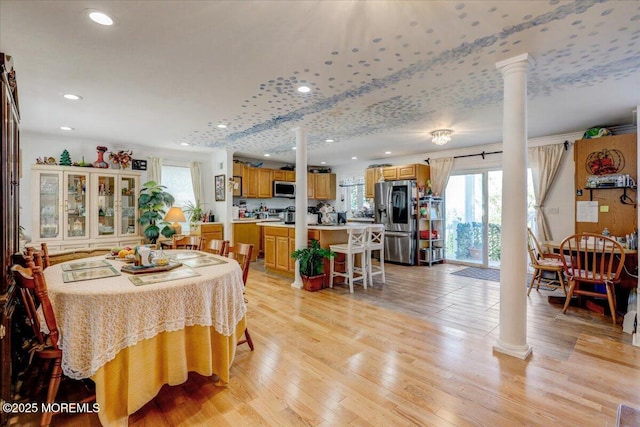 57 Shore Dr, Highlands, NJ 07732 - dining space featuring ornate columns, recessed lighting, and light wood-style floors