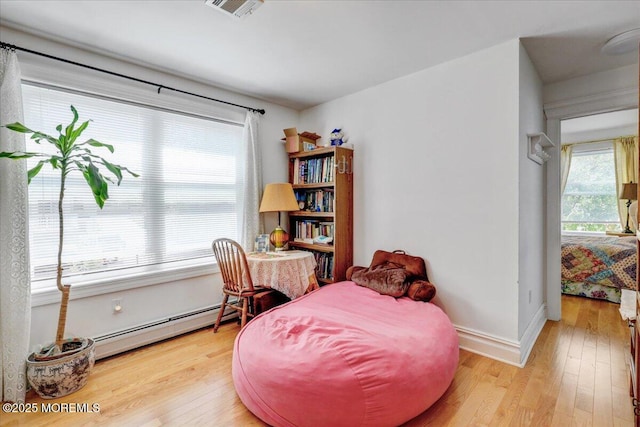 57 Shore Dr, Highlands, NJ 07732 - sitting room with a baseboard radiator, light wood finished floors, and baseboards