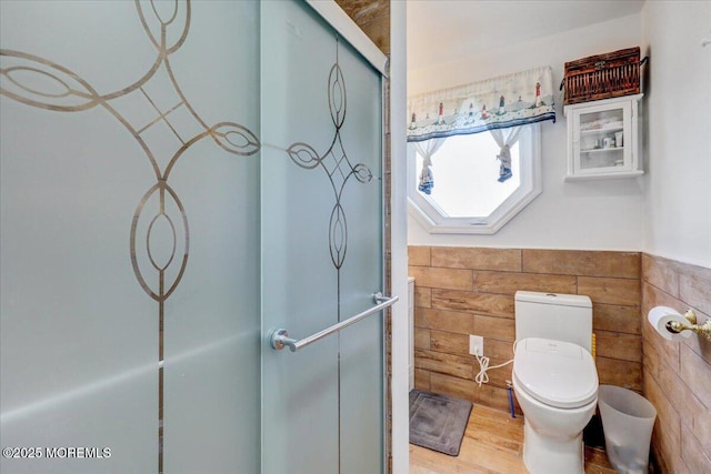 57 Shore Dr, Highlands, NJ 07732 - bathroom with a stall shower, wood finished floors, and toilet