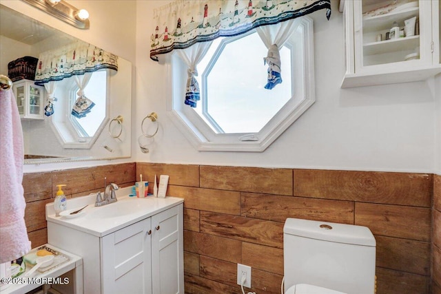 57 Shore Dr, Highlands, NJ 07732 - bathroom featuring wainscoting, vanity, a skylight, and toilet