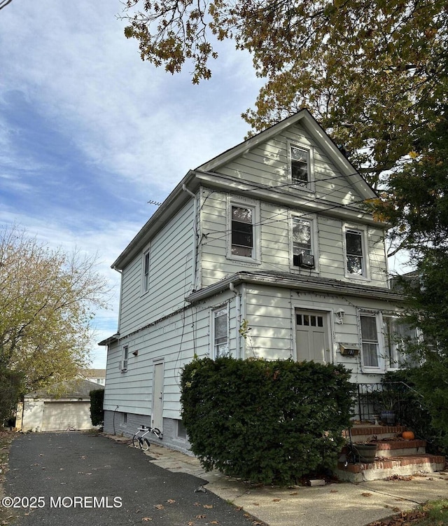 view of front of property featuring cooling unit
