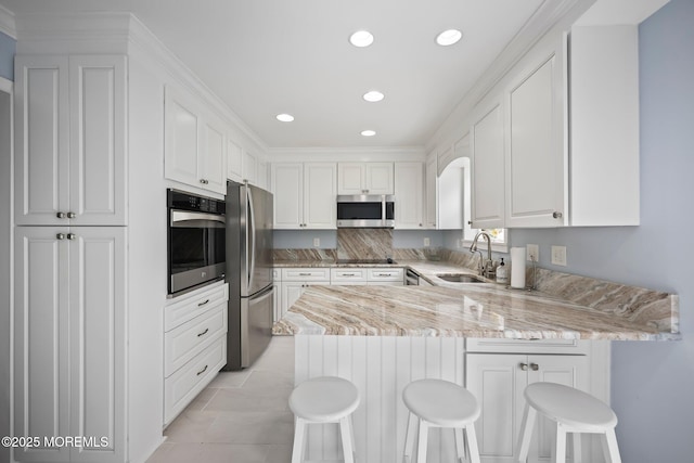 7 Colonial Ct, Manalapan, NJ 07726 - kitchen featuring appliances with stainless steel finishes, a sink, a peninsula, white cabinets, and recessed lighting