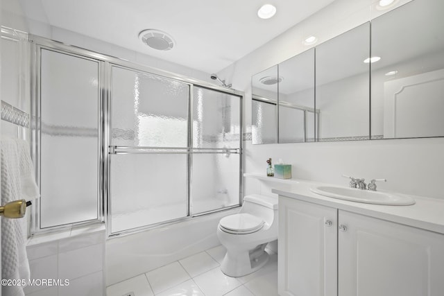 7 Colonial Ct, Manalapan, NJ 07726 - bathroom featuring tile patterned floors, toilet, combined bath / shower with glass door, and vanity