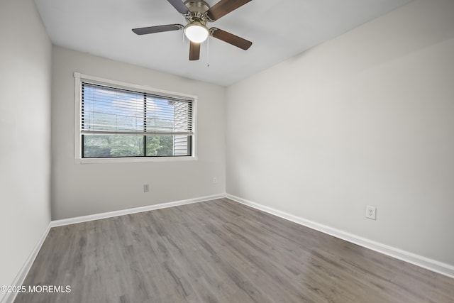 154 Cross Slope Ct Unit J, Manalapan, NJ 07726 - spare room with wood finished floors, baseboards, and ceiling fan