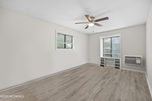 154 Cross Slope Ct Unit J, Manalapan, NJ 07726 - empty room featuring a wall mounted AC, wood finished floors, healthy amount of natural light, and ceiling fan