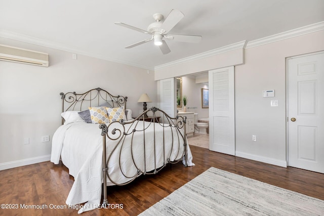 bedroom with a wall unit AC, ornamental molding, wood finished floors, and baseboards
