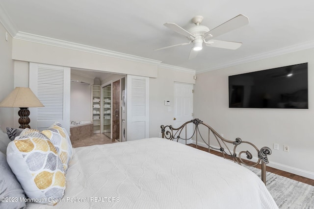 bedroom featuring ornamental molding, wood finished floors, a ceiling fan, and baseboards