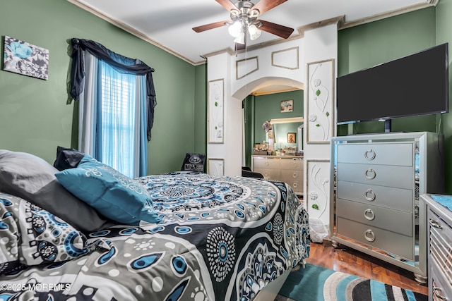 430 Myrtle Ave, Neptune Township, NJ 07753 - bedroom with ornamental molding, arched walkways, dark wood-type flooring, and ceiling fan