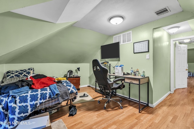 430 Myrtle Ave, Neptune Township, NJ 07753 - bedroom with wood finished floors, lofted ceiling, baseboards, and a desk