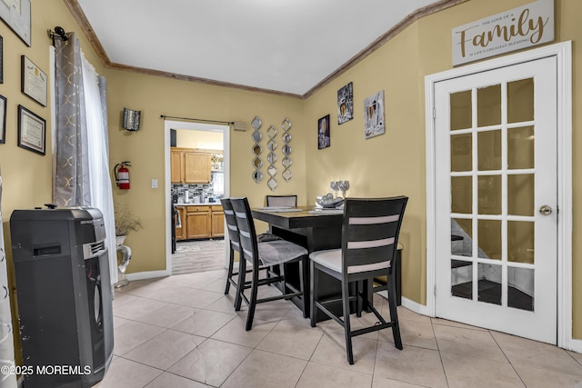 430 Myrtle Ave, Neptune Township, NJ 07753 - dining space featuring crown molding, light tile patterned floors, and baseboards