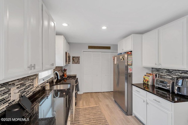 726 Hardean Rd, Brick, NJ 08724 - kitchen with appliances with stainless steel finishes, light wood finished floors, white cabinetry, a sink, and recessed lighting