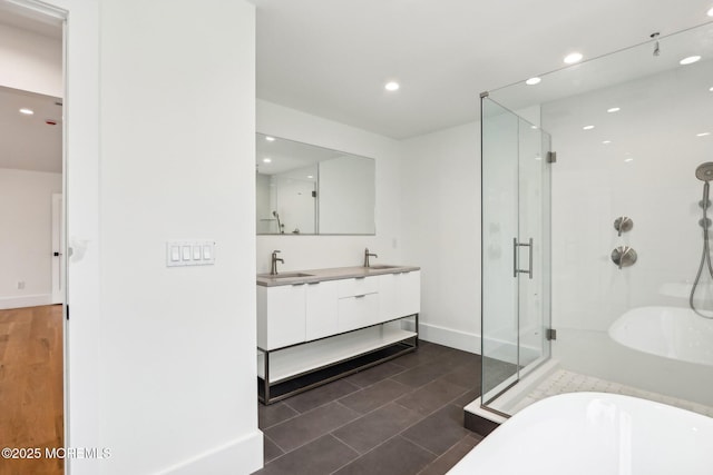 1 Foggia Way, Oceanport, NJ 07757 - bathroom with a stall shower, a freestanding bath, recessed lighting, baseboards, and double vanity