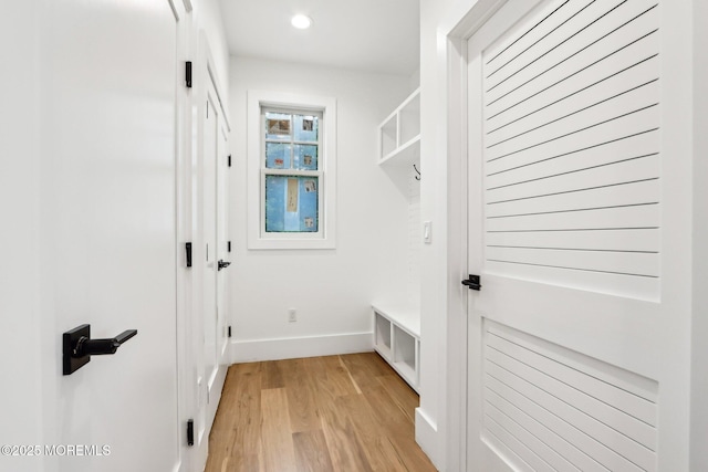 mudroom featuring light wood-style floors, baseboards, and recessed lighting