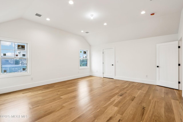 bonus room with lofted ceiling, light wood-style floors, recessed lighting, and baseboards