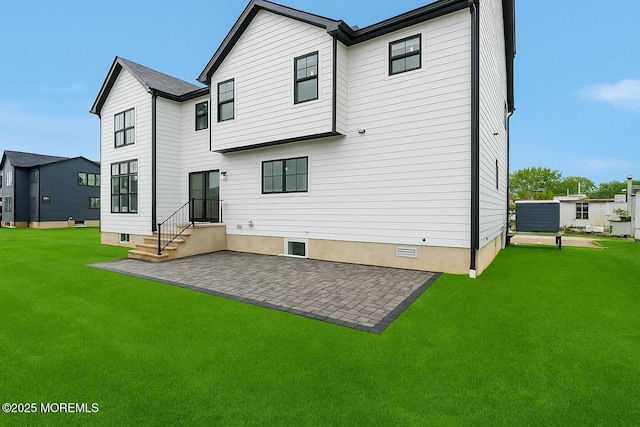 rear view of property with a patio and a lawn