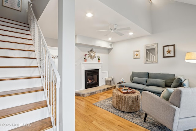 25 Meadow Ave Unit 30, Monmouth Beach, NJ 07750 - living room featuring wood finished floors, ceiling fan, recessed lighting, stairs, and a glass covered fireplace