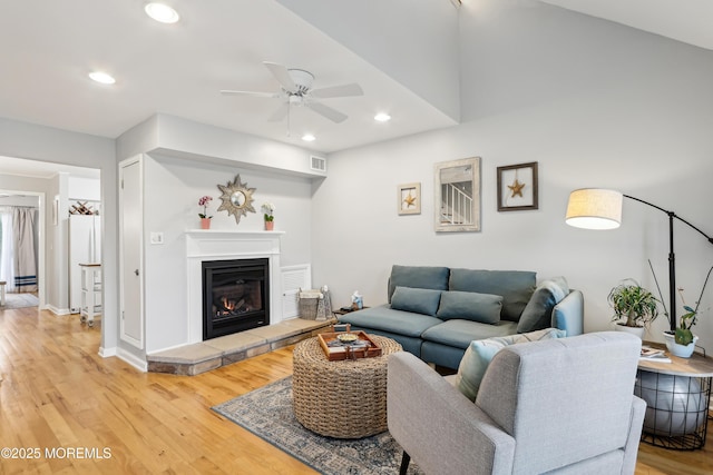 25 Meadow Ave Unit 30, Monmouth Beach, NJ 07750 - living room with light wood finished floors, ceiling fan, recessed lighting, a glass covered fireplace, and baseboards