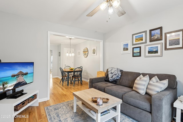 25 Meadow Ave Unit 30, Monmouth Beach, NJ 07750 - living room featuring light wood-style flooring, ceiling fan, baseboards, and a chandelier