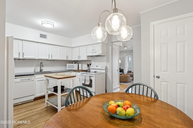 25 Meadow Ave Unit 30, Monmouth Beach, NJ 07750 - dining space with light wood-style floors and ceiling fan