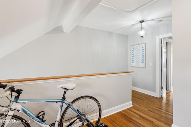 25 Meadow Ave Unit 30, Monmouth Beach, NJ 07750 - corridor featuring wood finished floors, baseboards, beam ceiling, and an upstairs landing