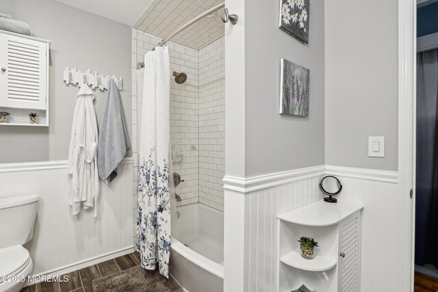 25 Meadow Ave Unit 30, Monmouth Beach, NJ 07750 - full bathroom featuring wood finished floors, wainscoting, toilet, and shower / bath combo with shower curtain