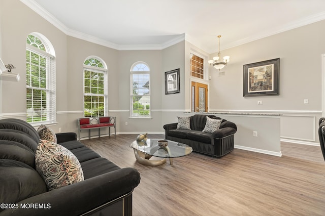 6 Beth Page Dr, Monroe, NJ 08831 - living room featuring wood finished floors, ornamental molding, healthy amount of natural light, a chandelier, and baseboards