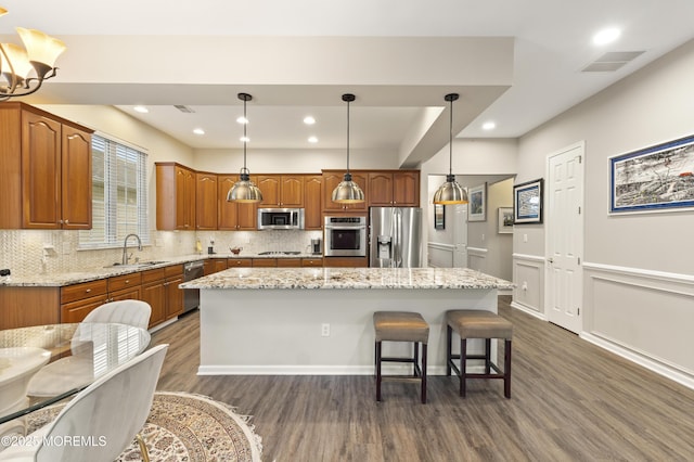 6 Beth Page Dr, Monroe, NJ 08831 - kitchen featuring stainless steel appliances, a sink, dark wood-style flooring, a kitchen island, and backsplash
