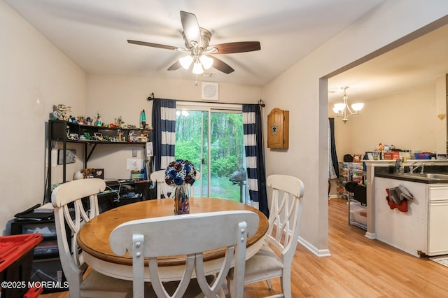 17 Canidae Ct, Tinton Falls, NJ 07753 - dining area with ceiling fan, light wood-style flooring, baseboards, and a chandelier