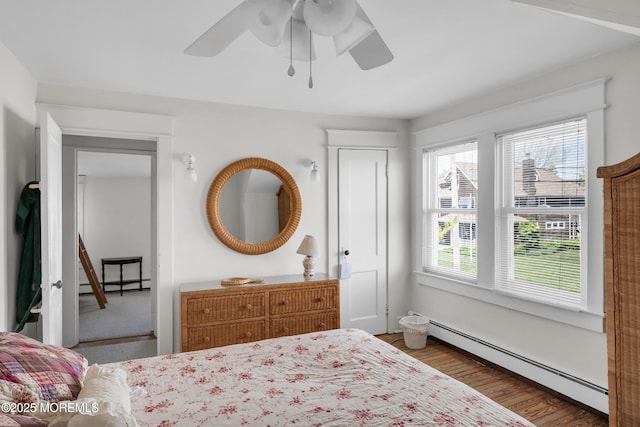 400 W Lake Ave, Bay Head, NJ 08742 - bedroom featuring a baseboard radiator, wood finished floors, and ceiling fan