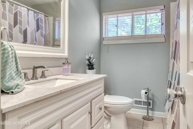bathroom with tile patterned floors, toilet, vanity, curtained shower, and baseboards