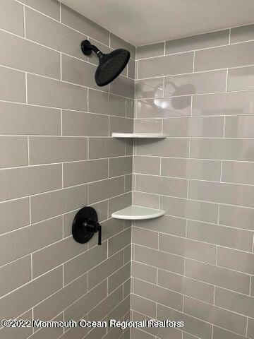 bathroom view of tiled shower